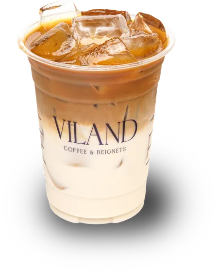 Iced coffee latte in a ViLand cup, coffee poured over milk